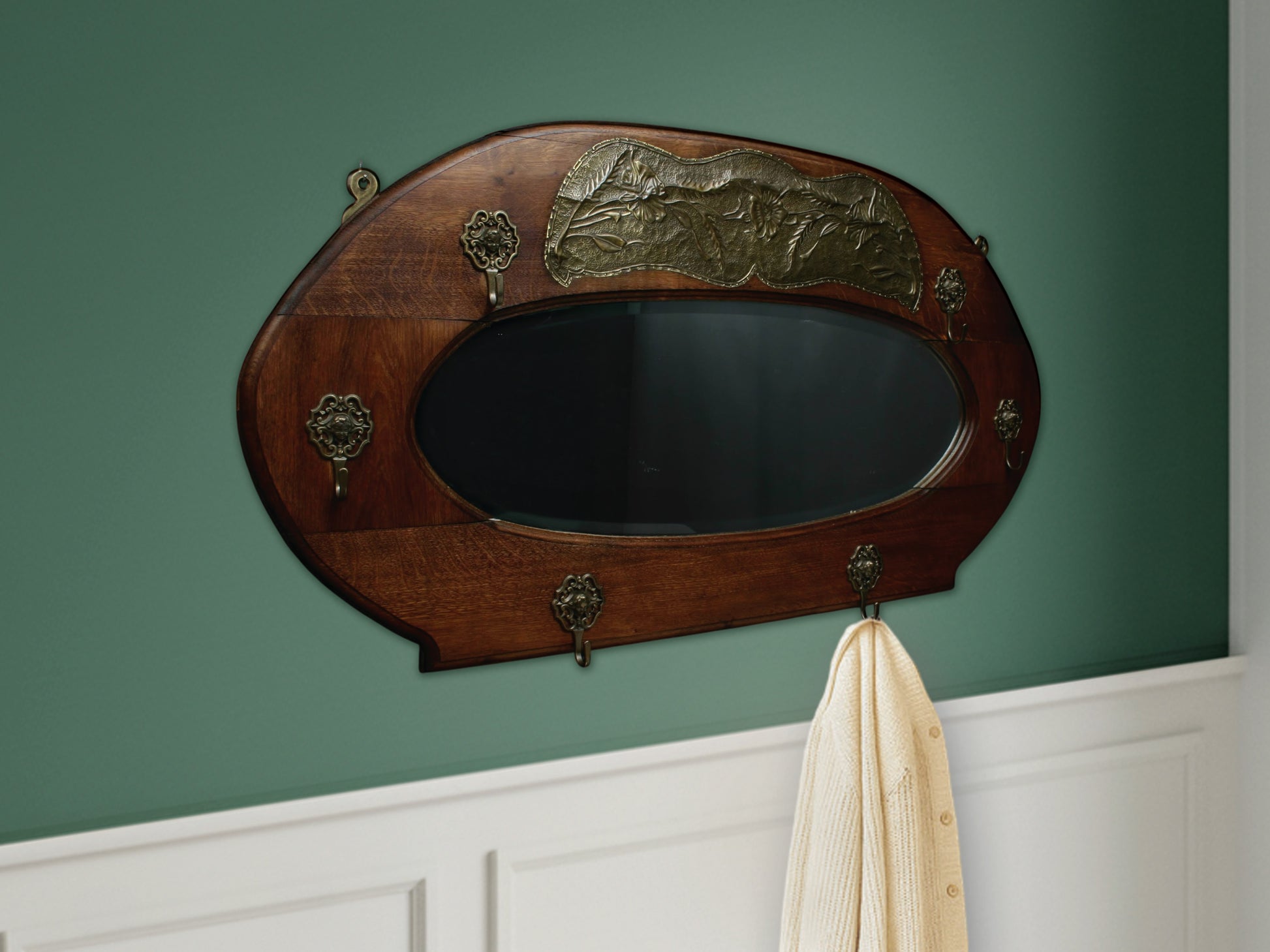 This vintage mirror wall coat rack is a stunning, unique mirror coat rack that's perfect for your modern or vintage home decor. Featuring a large beveled antique mirror set into a solid wood frame, it serves as a functional wall mount coat rack. Curated in Belgium, this piece is an ideal entryway coat rack / entryway mirror, bringing a functional and luxurious touch to any space.