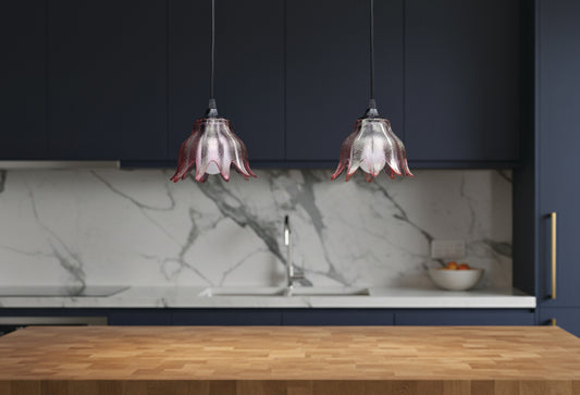 Transforming antique lighting glass shades into modern pendant lights! These stunning pink shades are 2 of 7 we salvaged from a beautiful but worn-out antique chandelier. Capture the essence of vintage charm while adding a touch of contemporary elegance to your space with these gorgeous hanging lights.