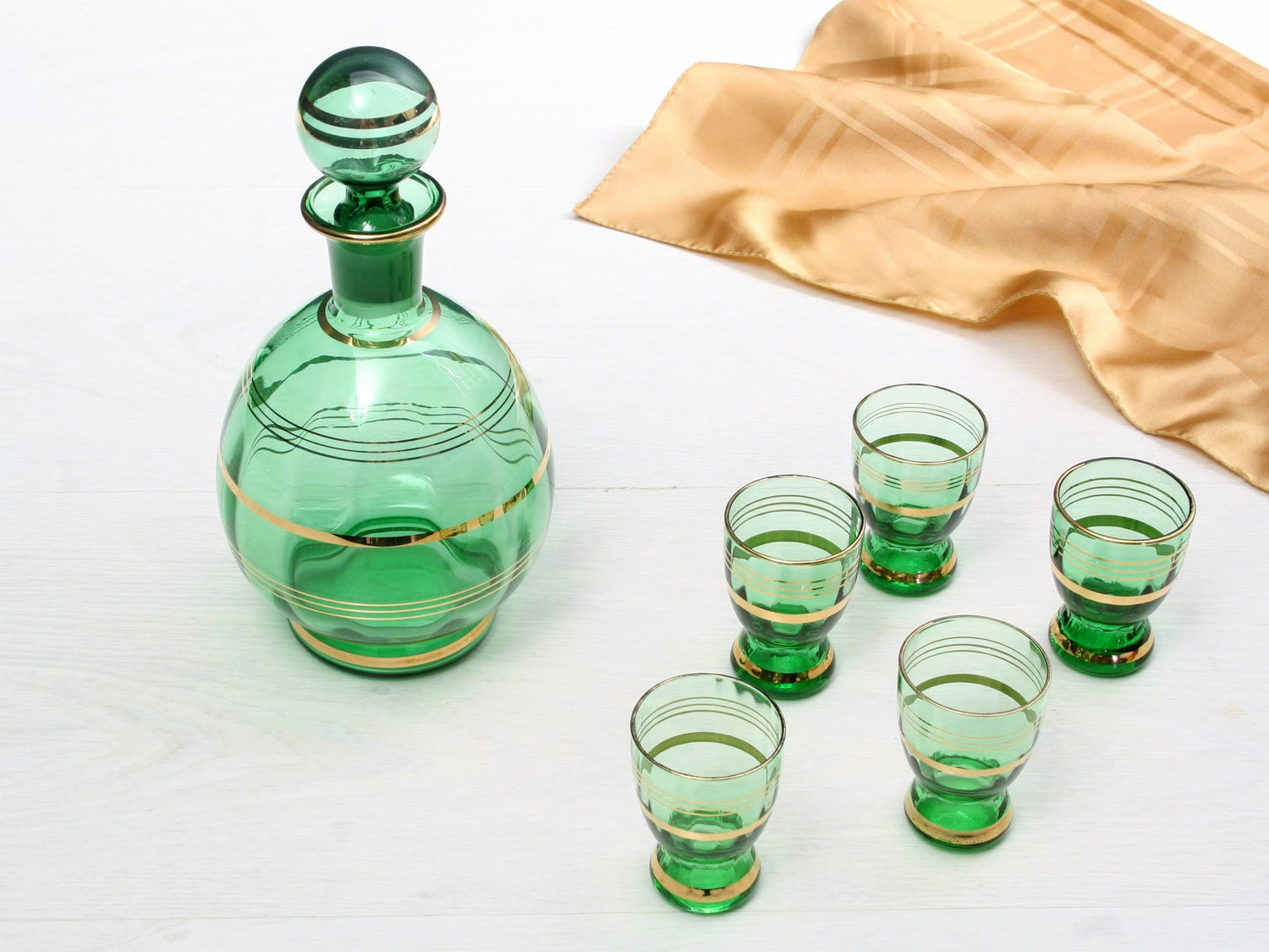 Antique and vintage barware from Europe. Liquor Decanters, antique glasses, etched wine glasses, unique shot glasses, and barware sets are just a few of the unique finds.