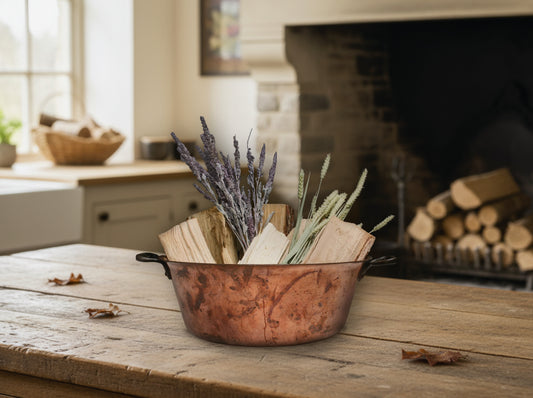 Antique Copper Pot used as a Firewood Holder for rustic Farmhouse Decor.