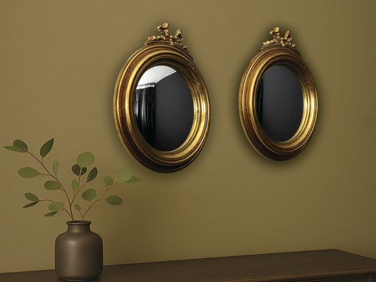 This elegant pair of antique gold wall mirrors adds charm to any modern or vintage home decor space. 