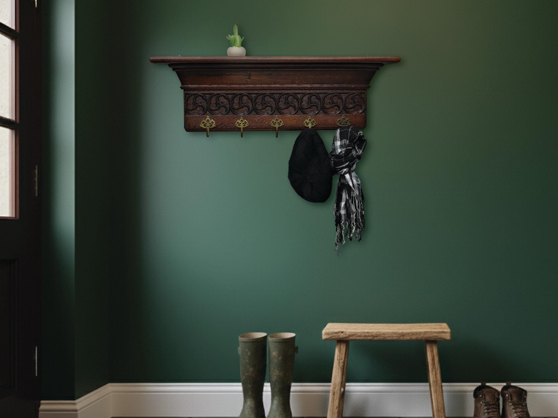  Late 1800s antique wall coat rack with shelf, intricate wood carvings, and 5 original brass hooks. Vintage entryway decor.