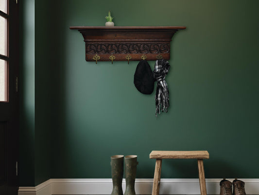  Late 1800s antique wall coat rack with shelf, intricate wood carvings, and 5 original brass hooks. Vintage entryway decor.