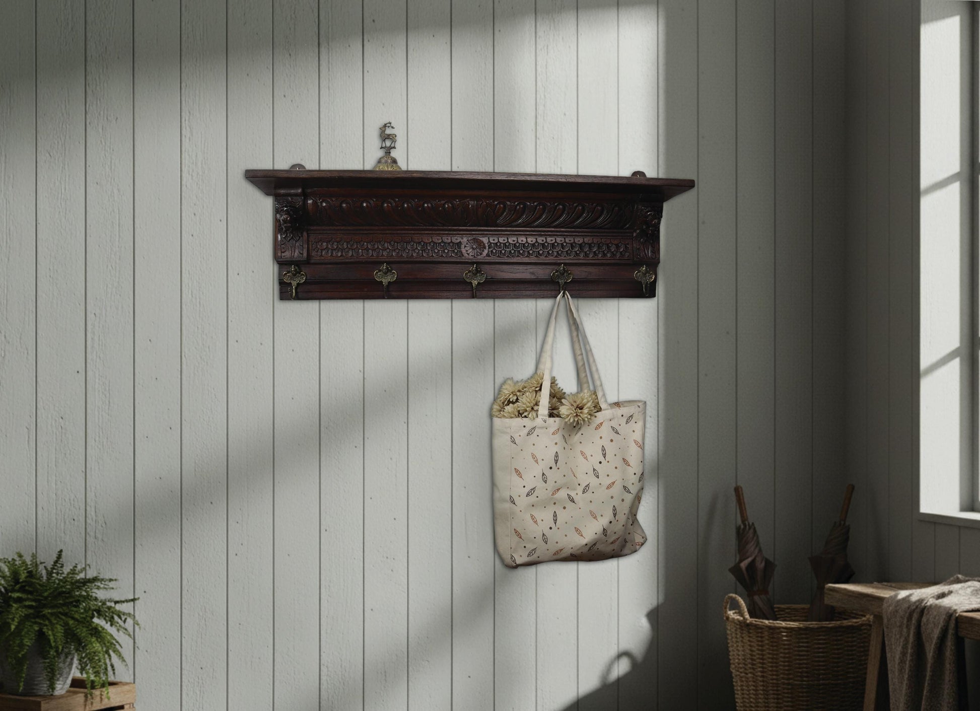 Antique coat rack with shelf featuring Renaissance Revival lion carvings and five brass putto hooks. A Mechelen style wall mount coat rack for vintage home decor.