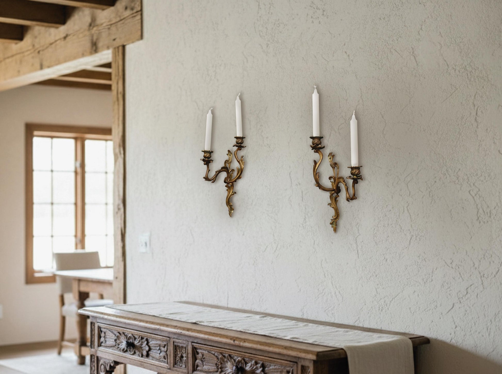 Pair of antique candle wall sconce fixtures made of solid bronze. Two-arm wall candle holders with ornate French details. Perfect unique gift ideas or vintage dining room lighting.