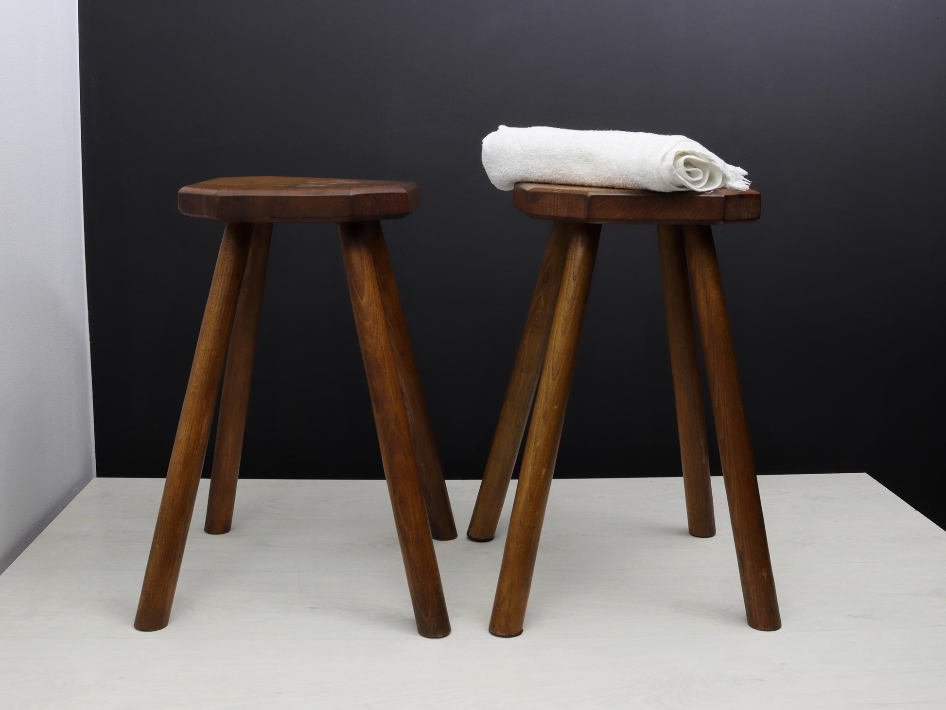 Pair of vintage stools from Belgium with octagonal seats. Sturdy wooden indoor plant stand or rustic farmhouse accent. Authentic vintage home decor perfect for unique gift ideas.