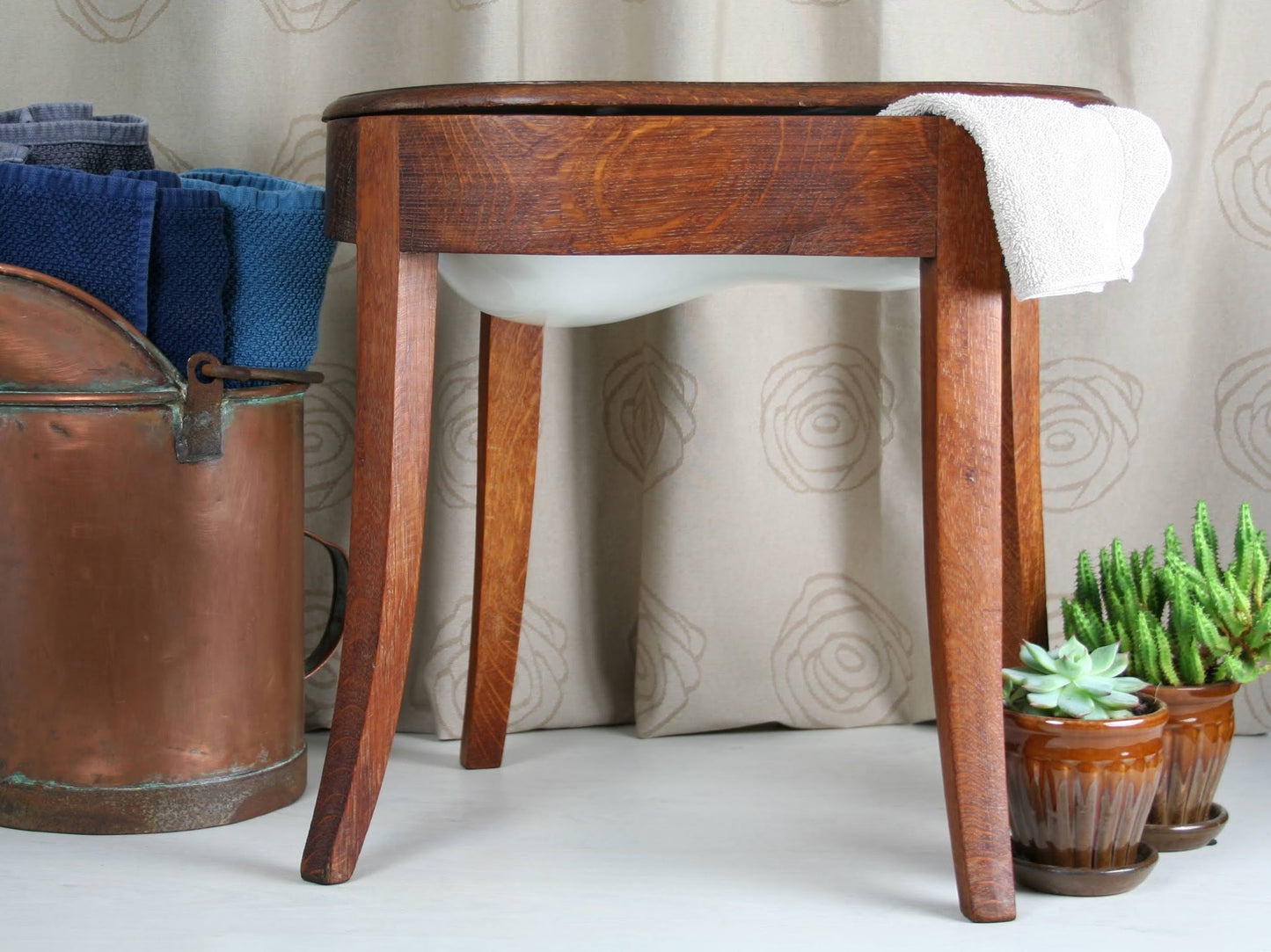 antique wash stand with enamel wash basin from the turn of the century